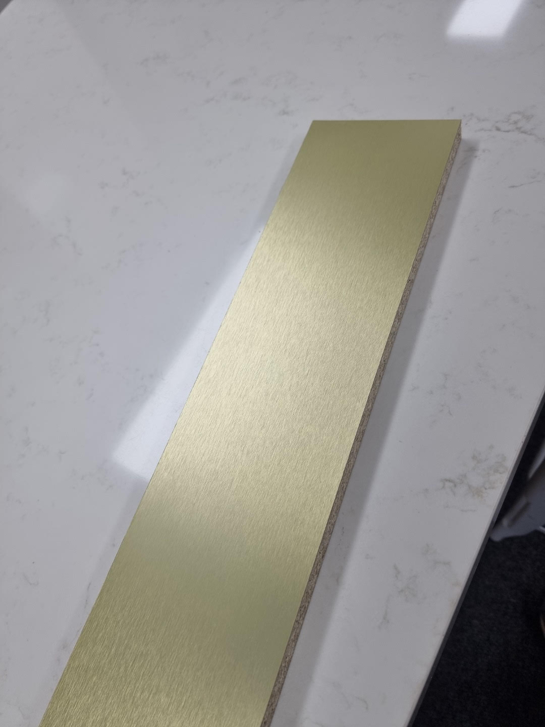 Stuck on board Brushed Gold colour Aluminium Kickboard Laminate Height 150mm.